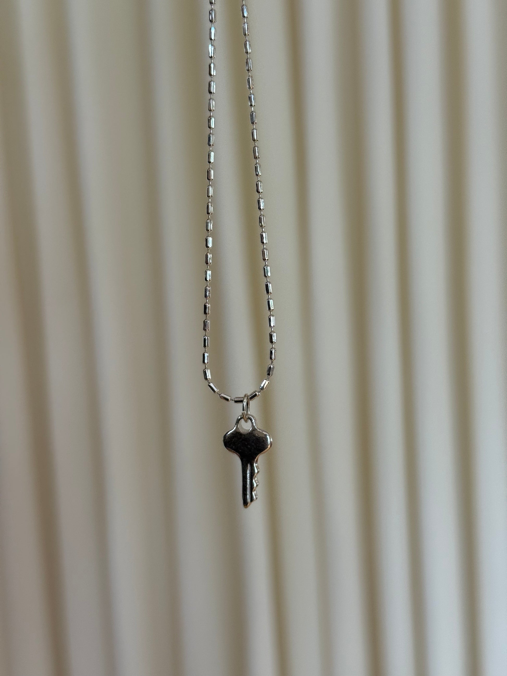 Silver Key Charm