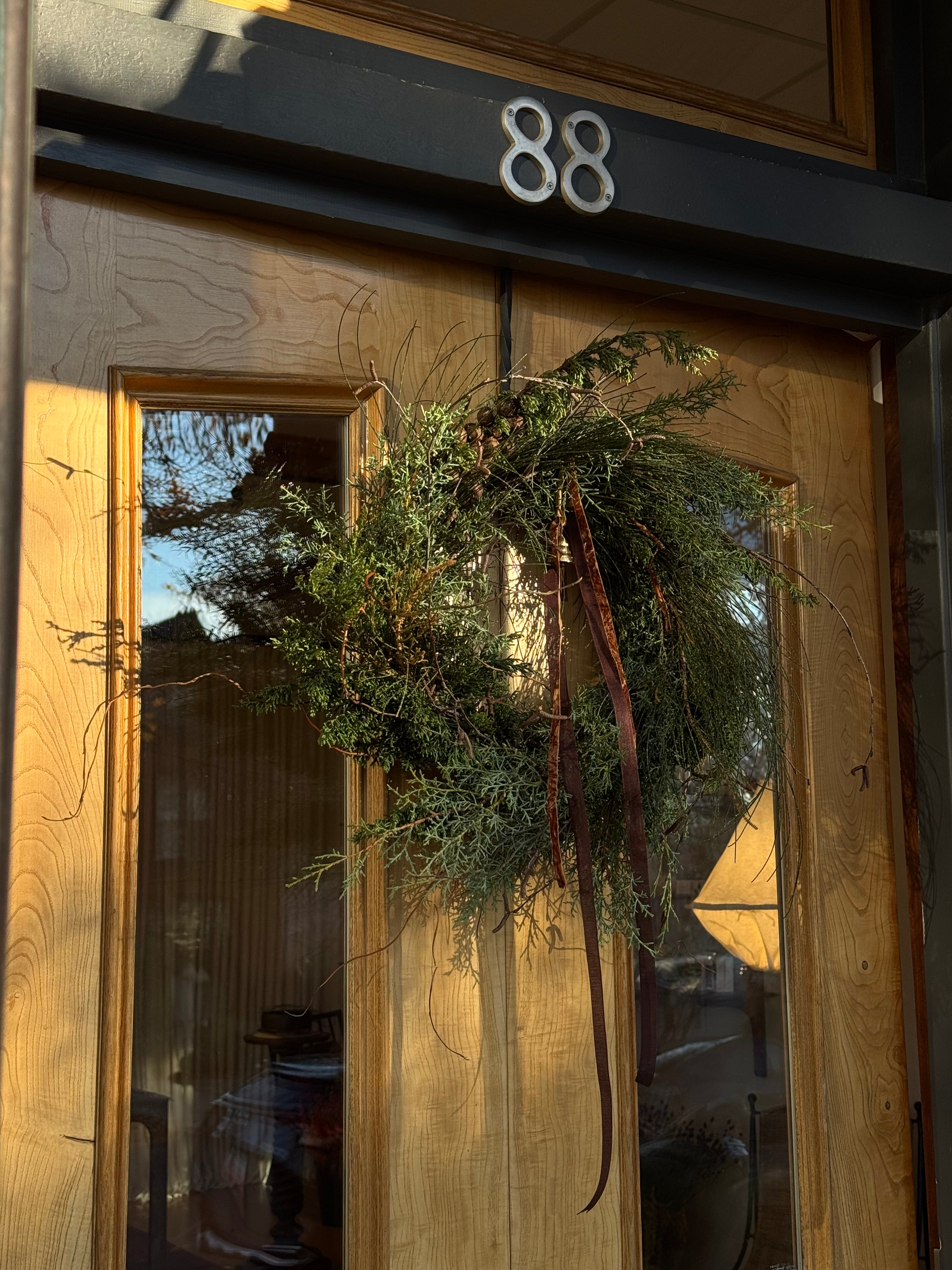 Wreath on a door with house number 88
